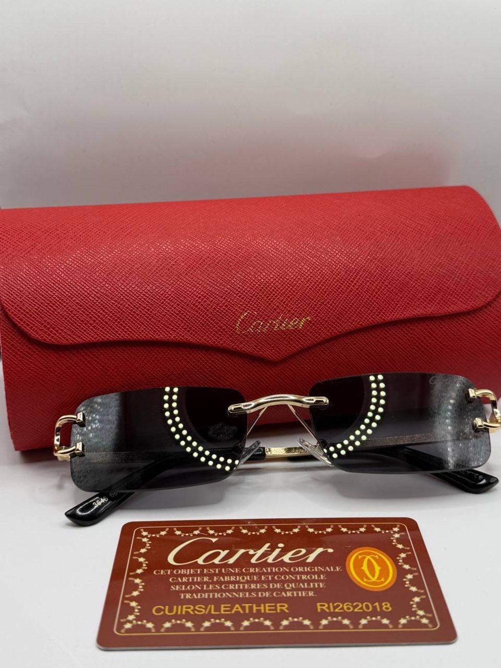 Cartier Black Rimless Sunglasses with Gold Detailing